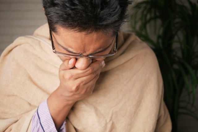 man sneezing from mold